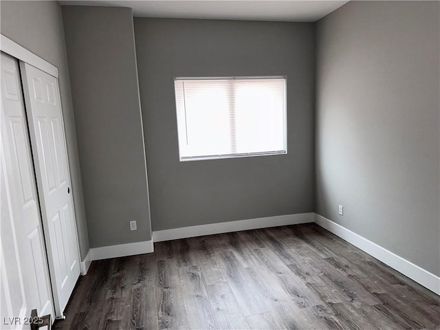 8993 Dorrell Ln, Las Vegas, NV 89149 - unfurnished bedroom featuring wood finished floors and a closet