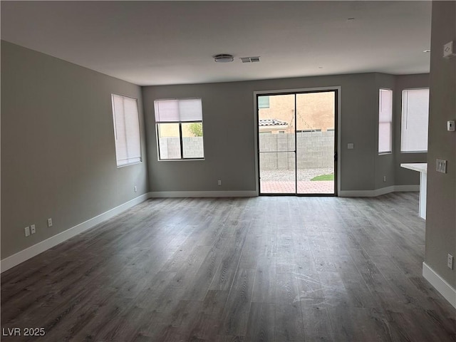 8993 Dorrell Ln, Las Vegas, NV 89149 - spare room featuring wood finished floors and baseboards