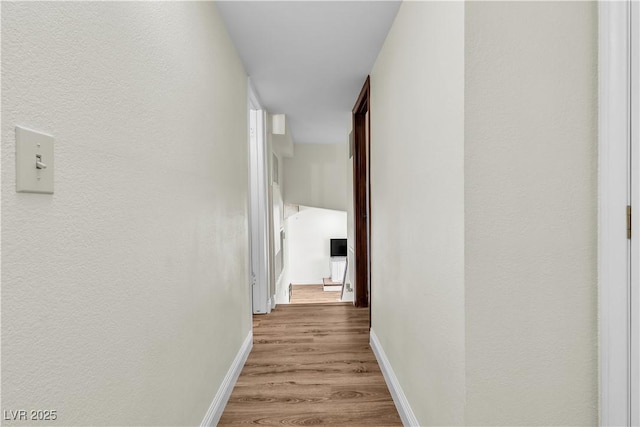 4654 Gabriel Dr, Las Vegas, NV 89121 - hall with baseboards and wood finished floors