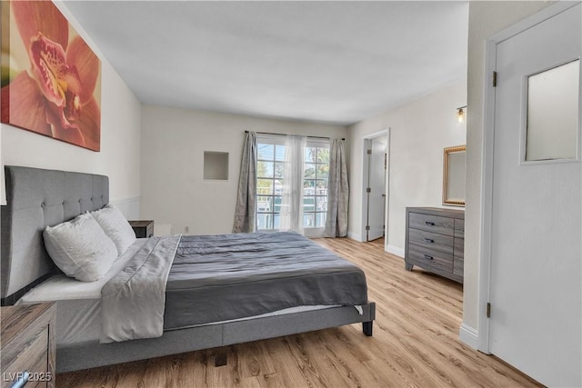 4654 Gabriel Dr, Las Vegas, NV 89121 - bedroom with light wood finished floors and baseboards