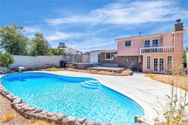 4654 Gabriel Dr, Las Vegas, NV 89121 - view of pool with french doors, a patio area, and a fenced backyard
