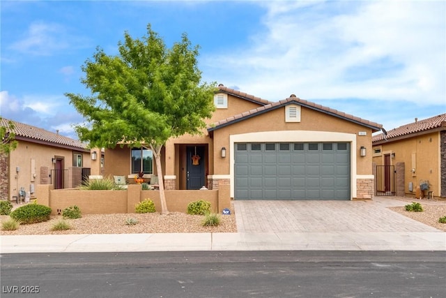 1860 Moonbow Falls St, Henderson, NV 89044 - view of front of property featuring a fenced front yard, stucco siding, an attached garage, and a gate