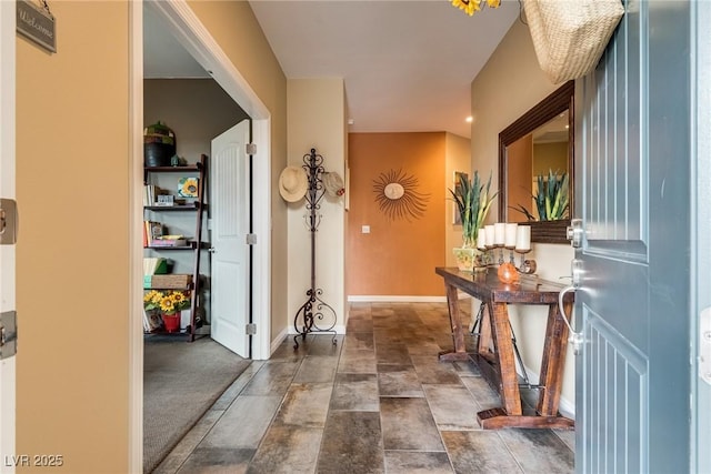 1860 Moonbow Falls St, Henderson, NV 89044 - hall with baseboards and dark stone finish floors