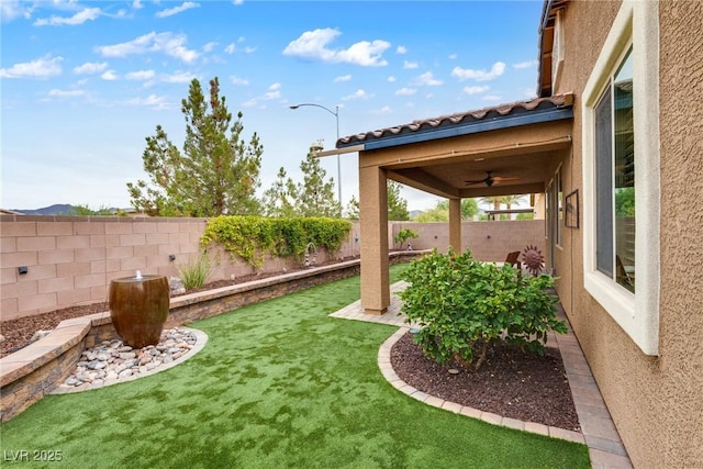 1860 Moonbow Falls St, Henderson, NV 89044 - fenced backyard featuring a ceiling fan and a patio