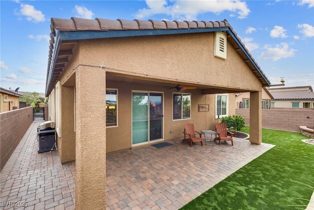 1860 Moonbow Falls St, Henderson, NV 89044 - back of house featuring stucco siding, a fenced backyard, a patio, and ceiling fan