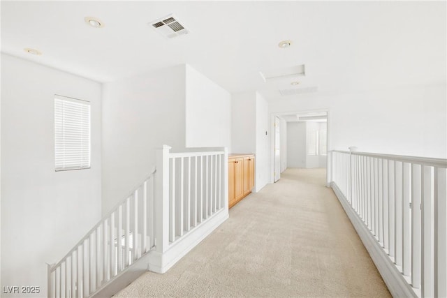8065 Retriever Ave, Las Vegas, NV 89147 - hall with an upstairs landing, light carpet, and attic access
