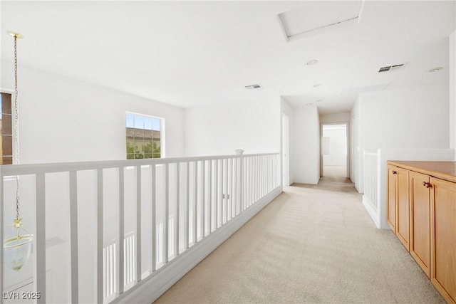 8065 Retriever Ave, Las Vegas, NV 89147 - corridor with light colored carpet and attic access
