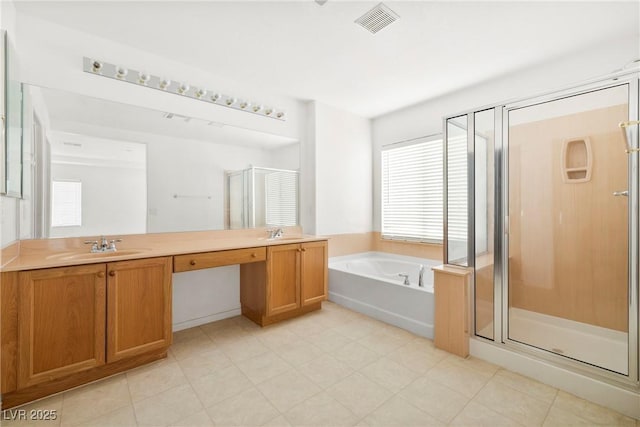 8065 Retriever Ave, Las Vegas, NV 89147 - bathroom featuring a garden tub, a shower stall, and double vanity