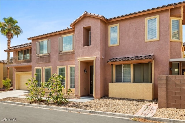 8065 Retriever Ave, Las Vegas, NV 89147 - view of front facade with a tiled roof, stucco siding, and an attached garage