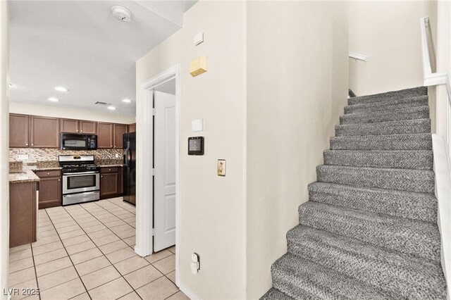 6044 Seneca Springs St, Las Vegas, NV 89130 - stairs with tile patterned floors and recessed lighting
