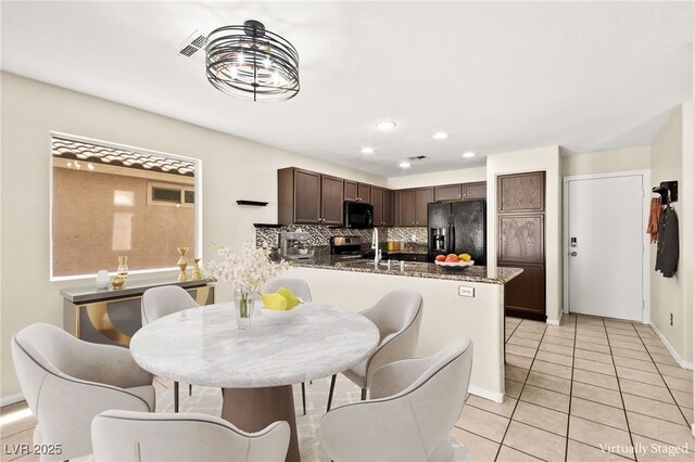 6044 Seneca Springs St, Las Vegas, NV 89130 - dining area with light tile patterned floors and recessed lighting