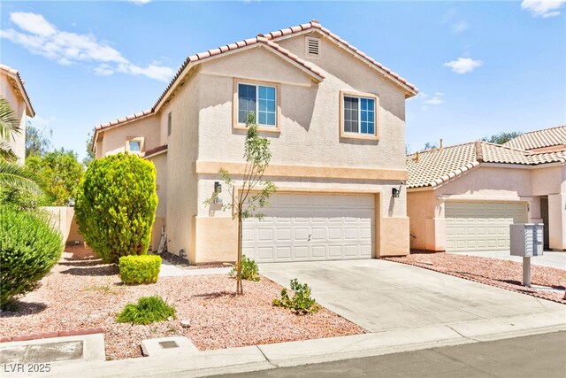 6044 Seneca Springs St, Las Vegas, NV 89130 - view of front of home featuring stucco siding, concrete driveway, a tiled roof, and an attached garage