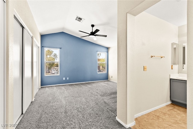 6044 Seneca Springs St, Las Vegas, NV 89130 - unfurnished bedroom with vaulted ceiling, a closet, carpet flooring, and a ceiling fan
