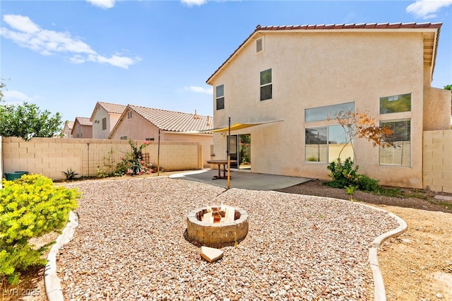 6044 Seneca Springs St, Las Vegas, NV 89130 - back of house featuring a fenced backyard, stucco siding, and a patio