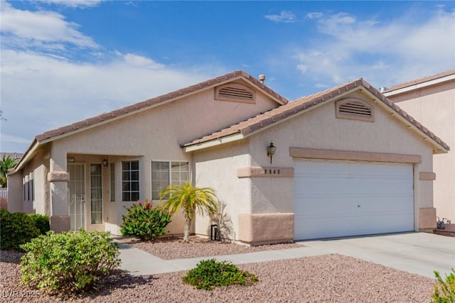 8840 Spinning Wheel Ave, Las Vegas, NV 89143 - mediterranean / spanish-style house featuring a garage, driveway, and stucco siding