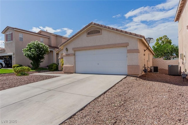 8840 Spinning Wheel Ave, Las Vegas, NV 89143 - view of front of property featuring driveway, stucco siding, and an attached garage