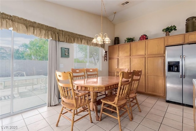 8840 Spinning Wheel Ave, Las Vegas, NV 89143 - dining room with light tile patterned floors, a chandelier, and high vaulted ceiling