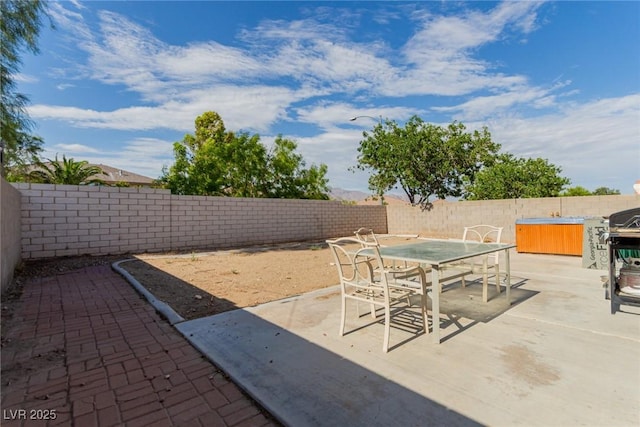 8840 Spinning Wheel Ave, Las Vegas, NV 89143 - fenced backyard with a patio area and outdoor dining space