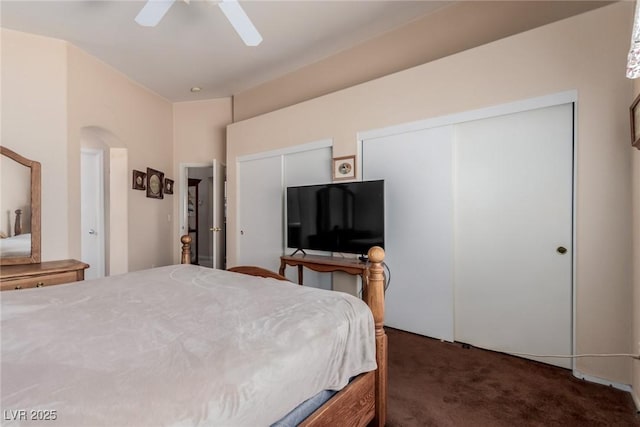 8840 Spinning Wheel Ave, Las Vegas, NV 89143 - carpeted bedroom featuring multiple closets, arched walkways, and ceiling fan