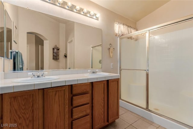 8840 Spinning Wheel Ave, Las Vegas, NV 89143 - full bathroom featuring a shower stall, tile patterned floors, and double vanity