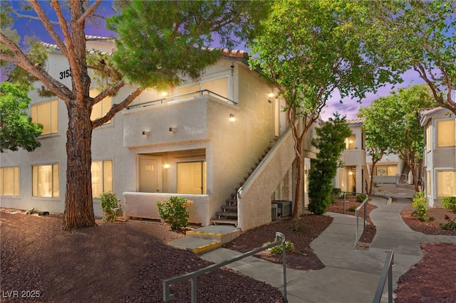 3152 Tarpon Dr Unit 203, Las Vegas, NV 89120 - view of front of house with stairway and stucco siding