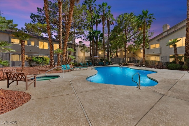 3152 Tarpon Dr Unit 203, Las Vegas, NV 89120 - pool at dusk featuring a community pool and a patio