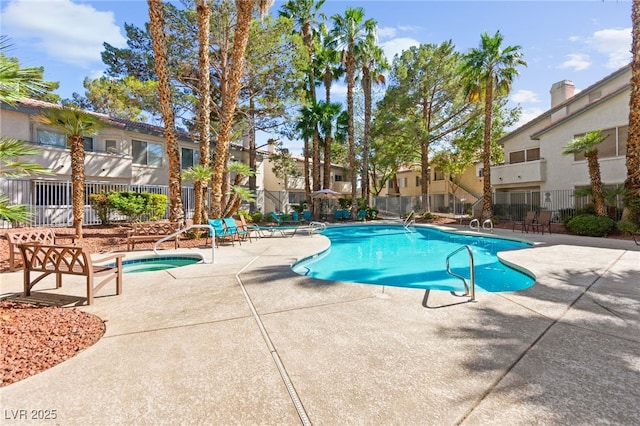 3152 Tarpon Dr Unit 203, Las Vegas, NV 89120 - community pool with a patio area, a community hot tub, and a residential view