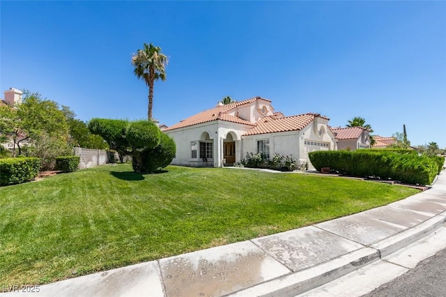 1939 Guinn Dr, Henderson, NV 89074 - mediterranean / spanish-style house with stucco siding, a tiled roof, and an attached garage
