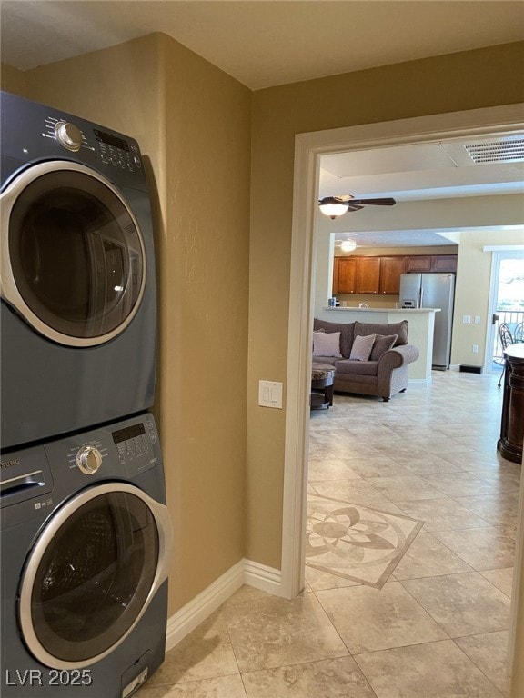 6868 Sky Pointe Dr Unit 1132, Las Vegas, NV 89131 - washroom with stacked washer / drying machine, ceiling fan, and light tile patterned flooring