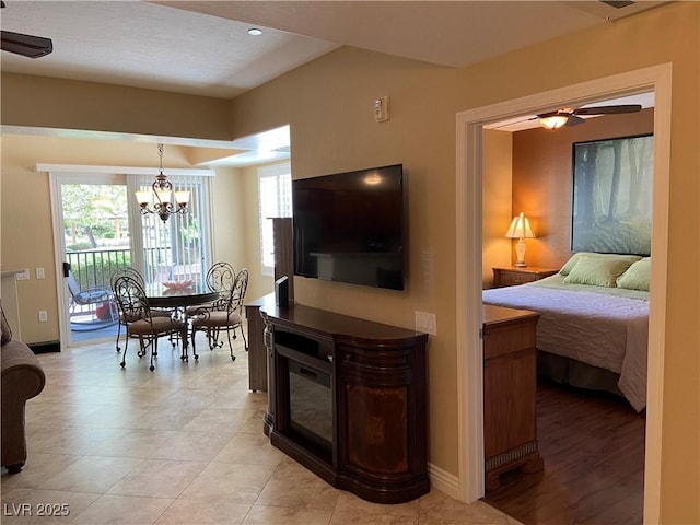 6868 Sky Pointe Dr Unit 1132, Las Vegas, NV 89131 - living room with a chandelier and ceiling fan