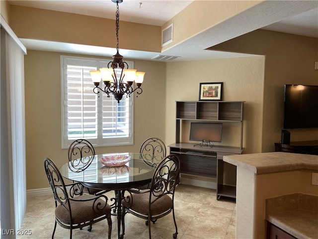 6868 Sky Pointe Dr Unit 1132, Las Vegas, NV 89131 - dining area featuring a chandelier and baseboards