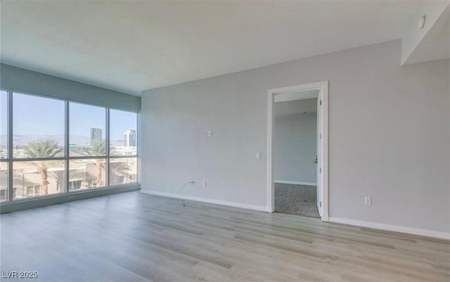 4575 Dean Martin Dr Unit 406, Las Vegas, NV 89103 - spare room featuring light wood finished floors