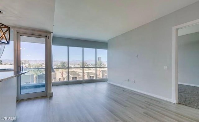 4575 Dean Martin Dr Unit 406, Las Vegas, NV 89103 - empty room with wood finished floors and baseboards