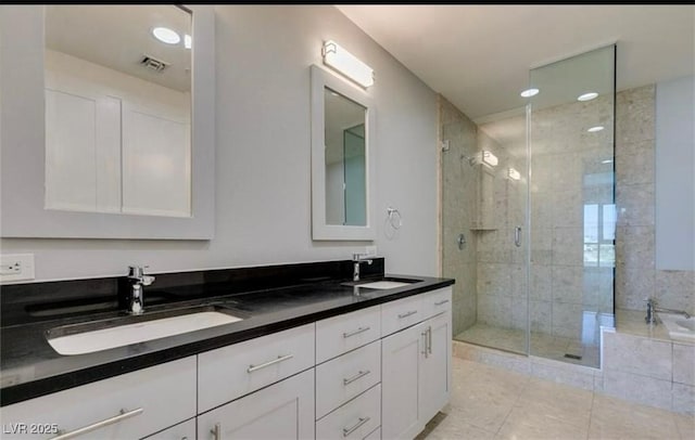 4575 Dean Martin Dr Unit 406, Las Vegas, NV 89103 - full bathroom featuring double vanity, a stall shower, tile patterned flooring, and a bath