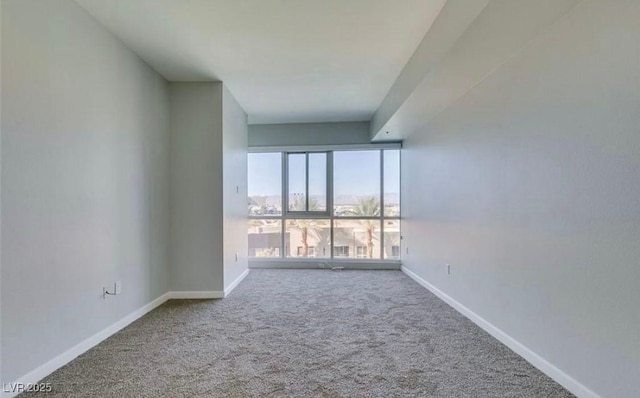 4575 Dean Martin Dr Unit 406, Las Vegas, NV 89103 - carpeted empty room featuring baseboards