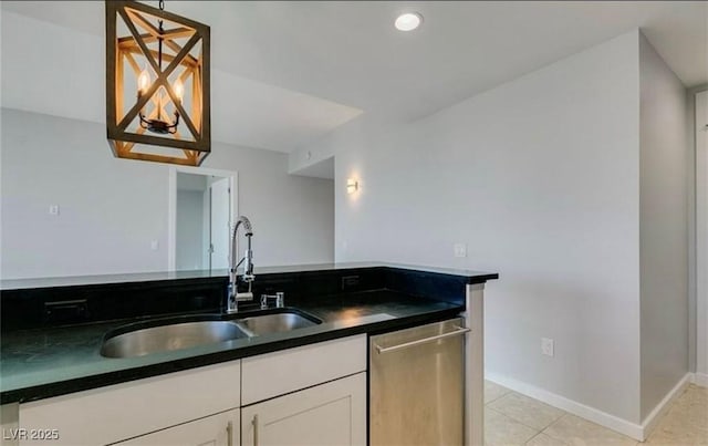 4575 Dean Martin Dr Unit 406, Las Vegas, NV 89103 - kitchen with stainless steel dishwasher, dark countertops, white cabinetry, light tile patterned flooring, and recessed lighting