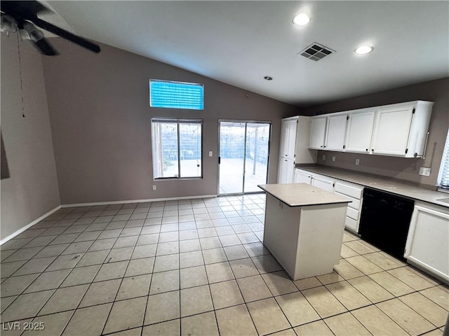 5513 Oakwood Ridge St, Las Vegas, NV 89130 - kitchen featuring dishwasher, lofted ceiling, ceiling fan, light tile patterned floors, and a center island