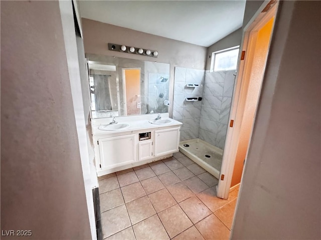 5513 Oakwood Ridge St, Las Vegas, NV 89130 - full bath featuring tile patterned floors, tiled shower, and double vanity
