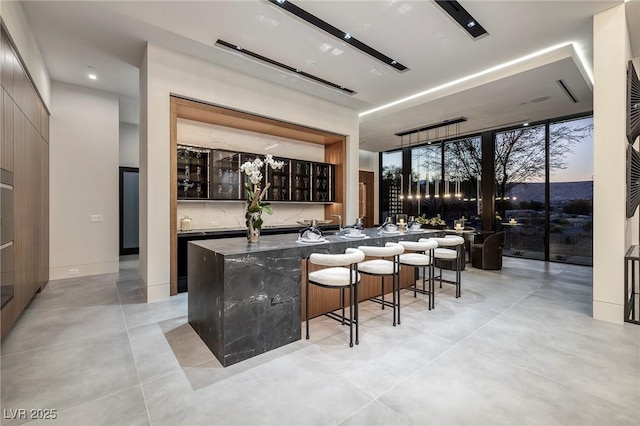 10891 Stardust Dr, Las Vegas, NV 89135 - indoor wet bar with concrete floors