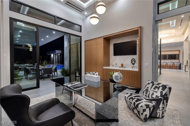 10891 Stardust Dr, Las Vegas, NV 89135 - living area with a towering ceiling and light tile patterned floors