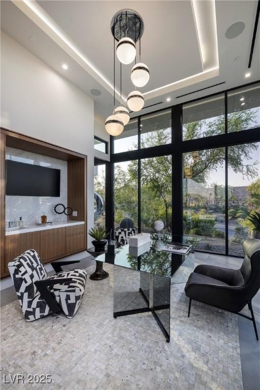 10891 Stardust Dr, Las Vegas, NV 89135 - living area featuring expansive windows and a high ceiling
