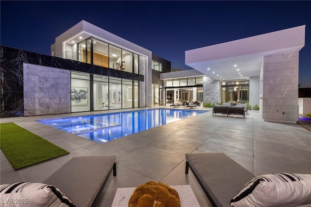 10891 Stardust Dr, Las Vegas, NV 89135 - pool at twilight with a pool with connected hot tub