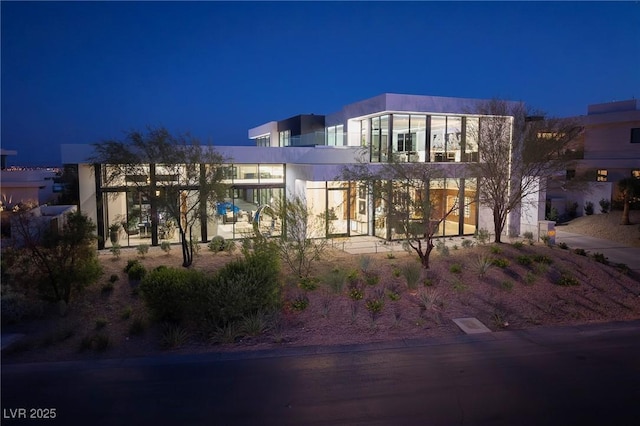 10891 Stardust Dr, Las Vegas, NV 89135 - view of property at twilight