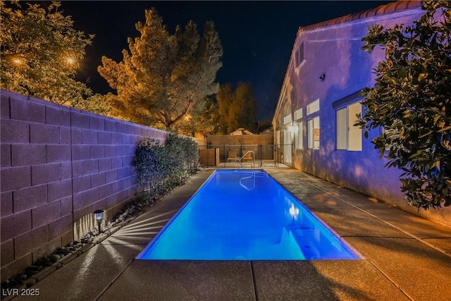 4065 Genoa Dr, Las Vegas, NV 89141 - pool at twilight featuring a fenced backyard and a patio