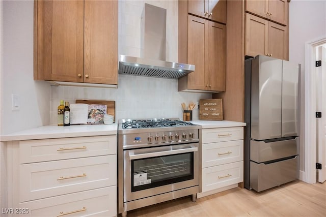 4065 Genoa Dr, Las Vegas, NV 89141 - kitchen featuring appliances with stainless steel finishes, wall chimney exhaust hood, light countertops, and backsplash
