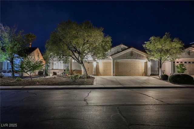 4065 Genoa Dr, Las Vegas, NV 89141 - view of front facade with a garage, concrete driveway, and stucco siding