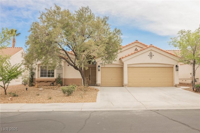 4065 Genoa Dr, Las Vegas, NV 89141 - view of front of house featuring an attached garage, concrete driveway, stucco siding, and a tile roof