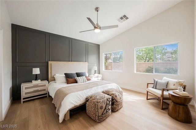 4065 Genoa Dr, Las Vegas, NV 89141 - bedroom with light wood-style flooring, high vaulted ceiling, and a ceiling fan