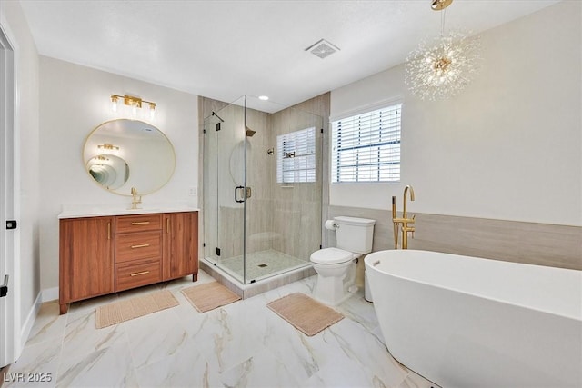 2740 Family Ct, Las Vegas, NV 89117 - full bathroom featuring vanity, a shower stall, a freestanding bath, and marble finish flooring