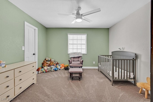 2740 Family Ct, Las Vegas, NV 89117 - carpeted bedroom with a crib and a ceiling fan